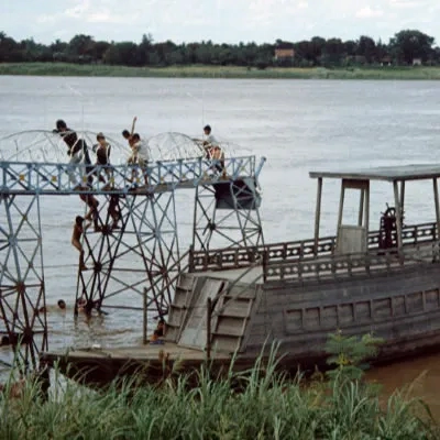 Boat and children swimming, Phnomh Penh