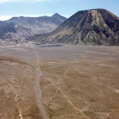 Mount Bromo (left) and Mount Batok volcanoes across the 'sand sea'