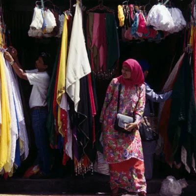 A Malay woman wearing a baju kurung, central KL